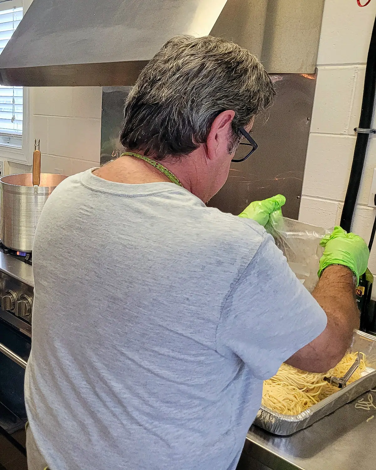 Ron Kelly stirring the spaghetti
