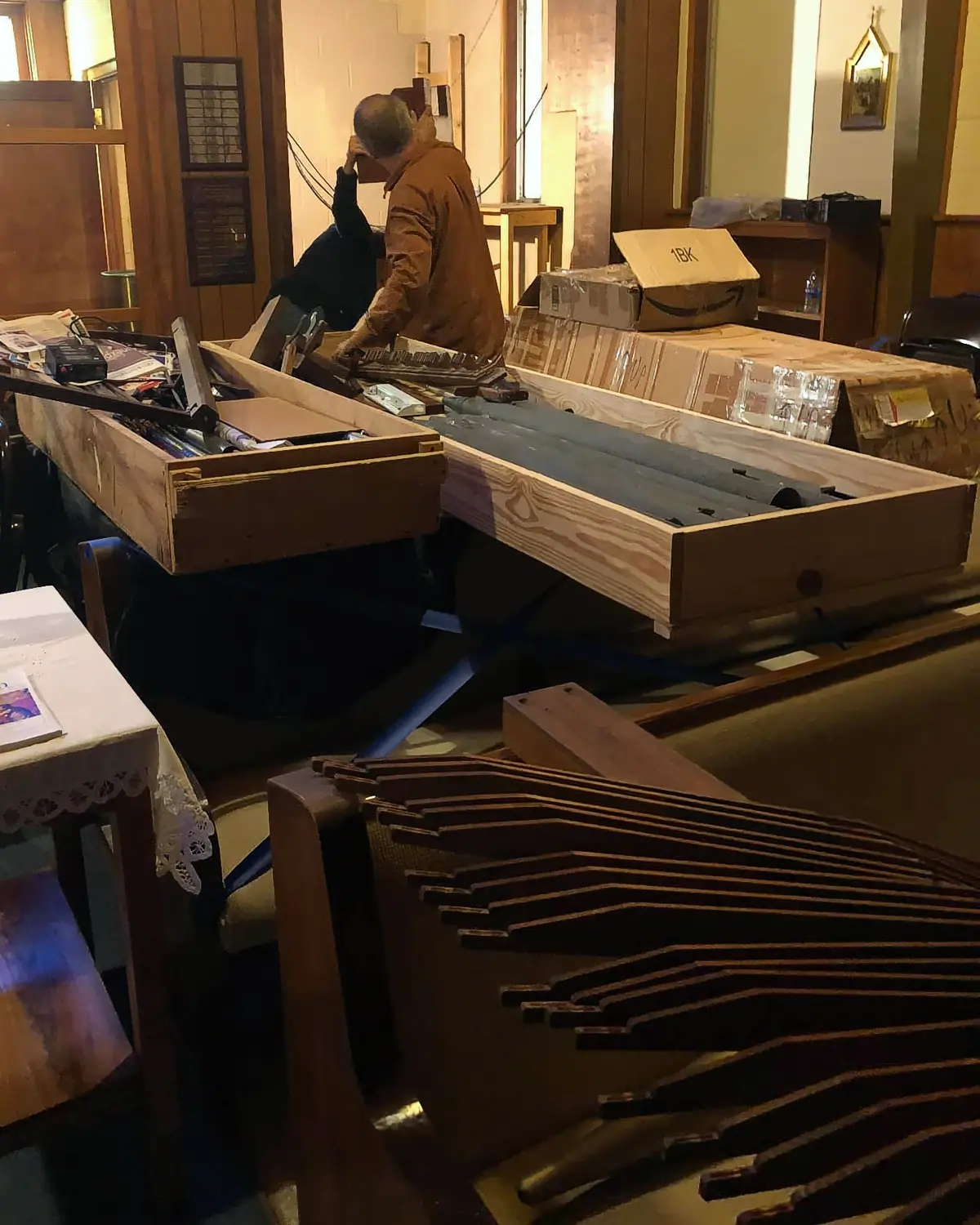 the new organ delivered in pieces being assembled on site