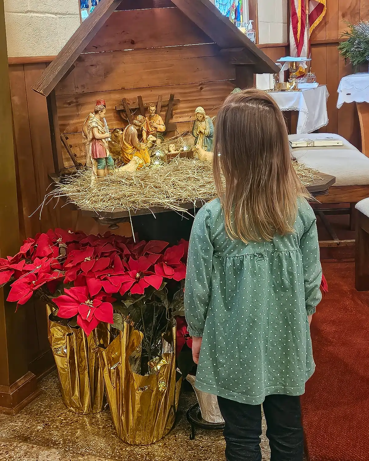 Young visitor joyfully admiring the nativity <em>by Anonymous