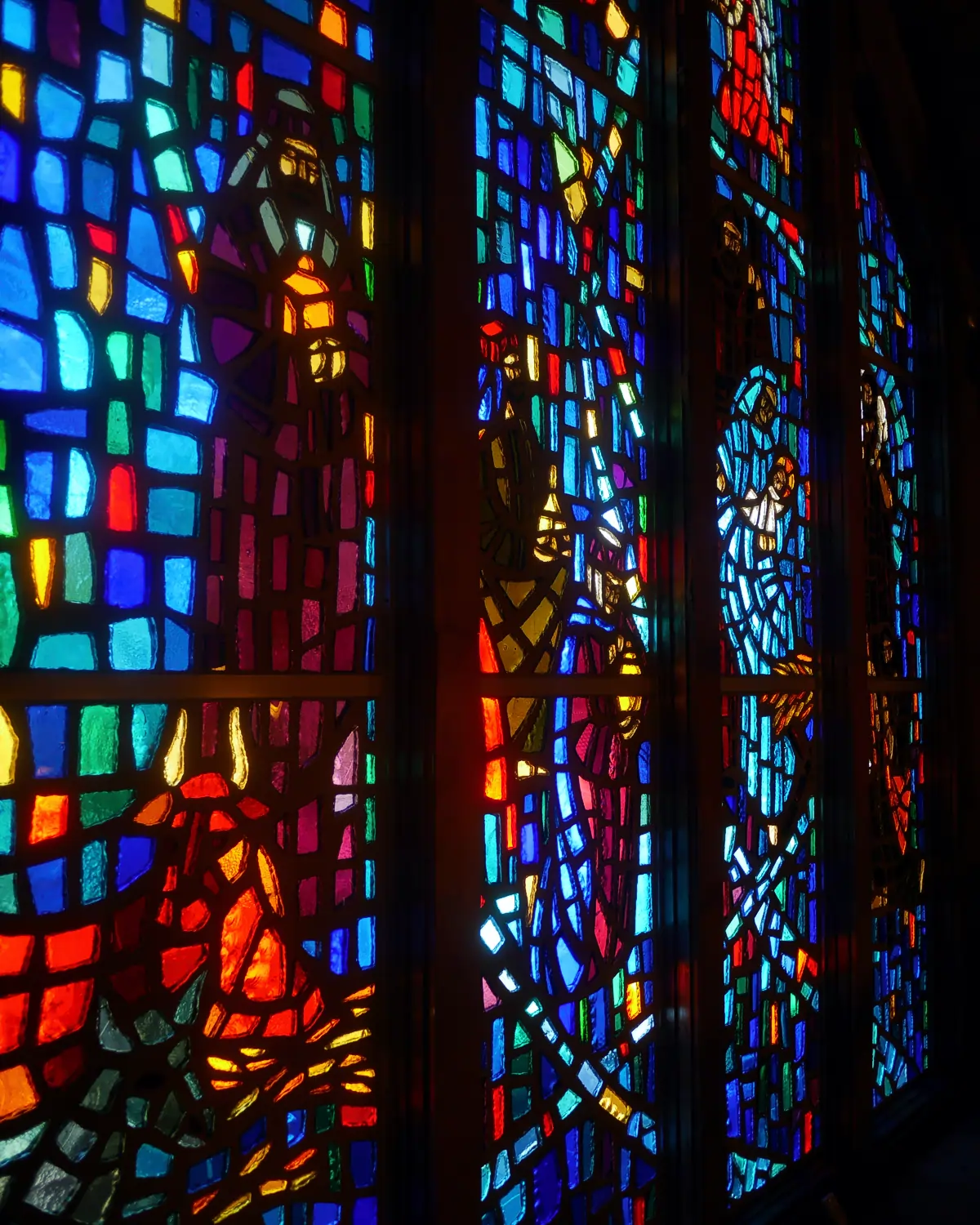 Stained glass wall at the entrance way to St. Joseph Catholic Church as seen from the loft
