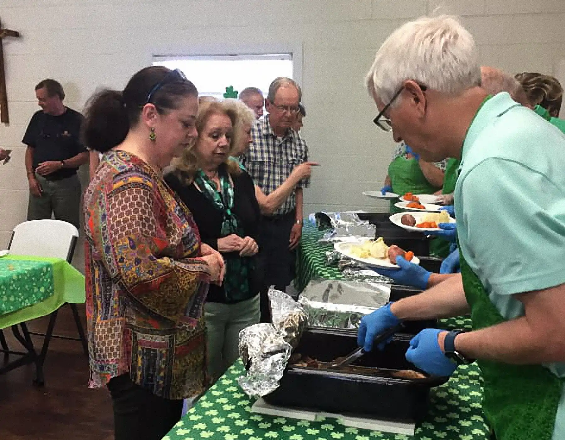 St. Patrick’s Day Dinner St. Patrick’s Day Dinner with images of servers plating dinners